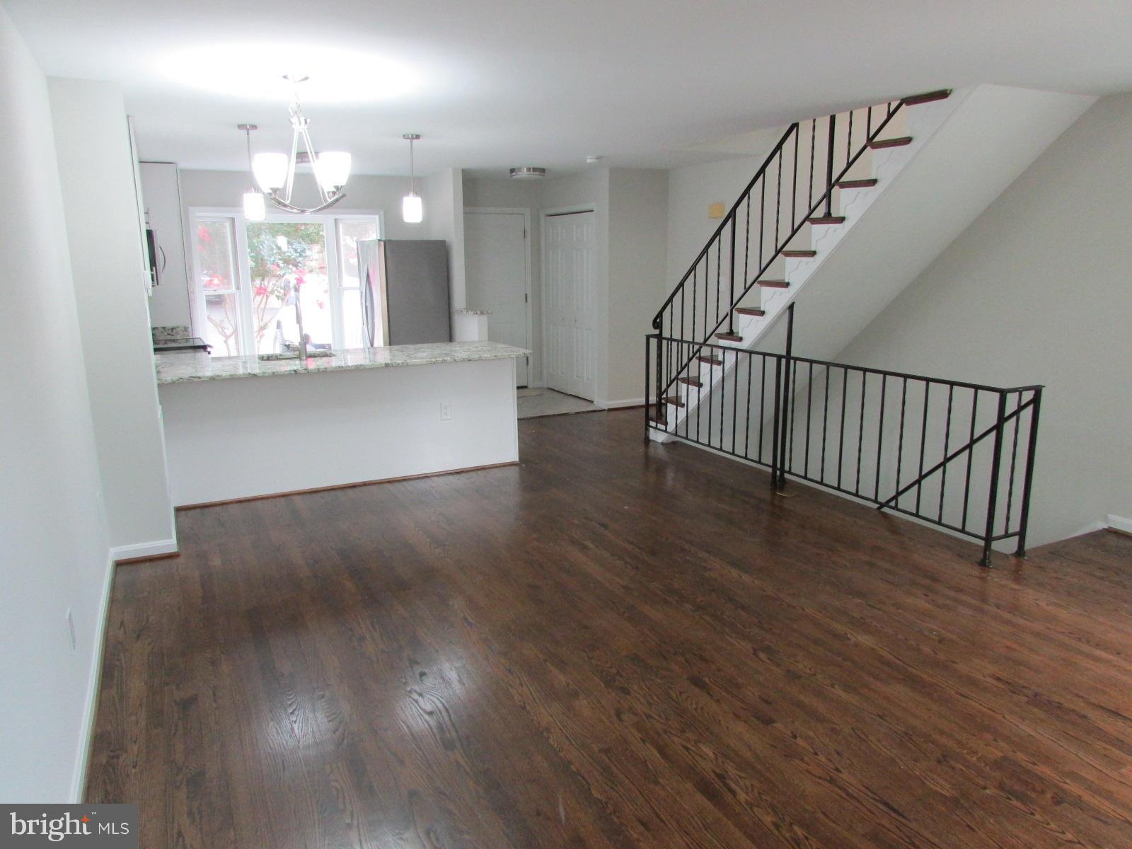2029 South Glebe Road Arlington, VA 22206 - Photo 4 of 14 a view of a chandelier and wooden floor
