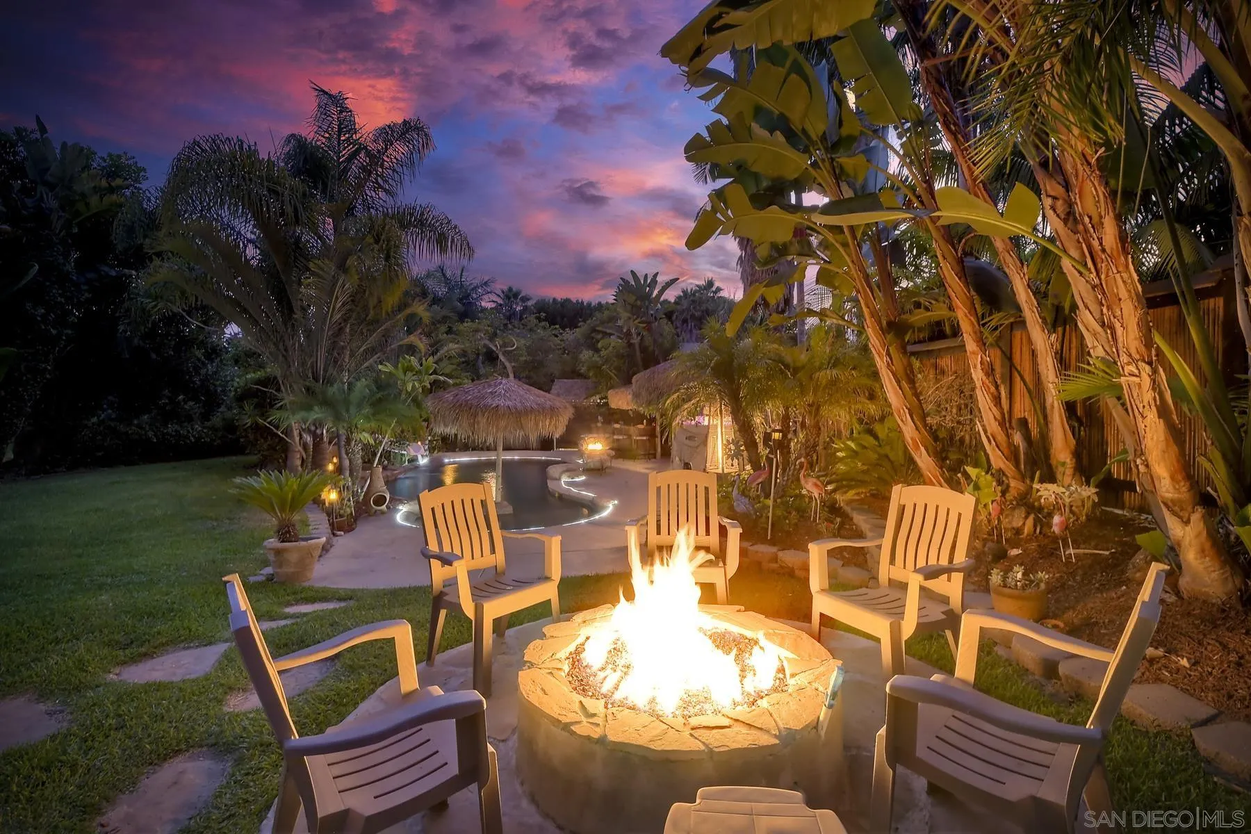 a view of a backyard with plants and a patio