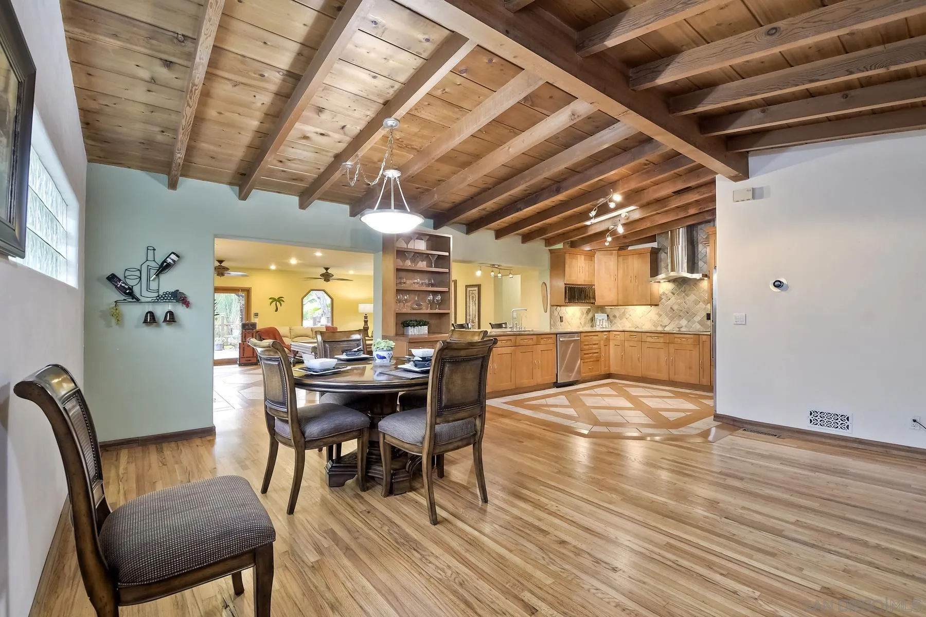 536 Saxony Road Encinitas, CA 92024 - Photo 16 of 57 a dining room with furniture window and wooden floor