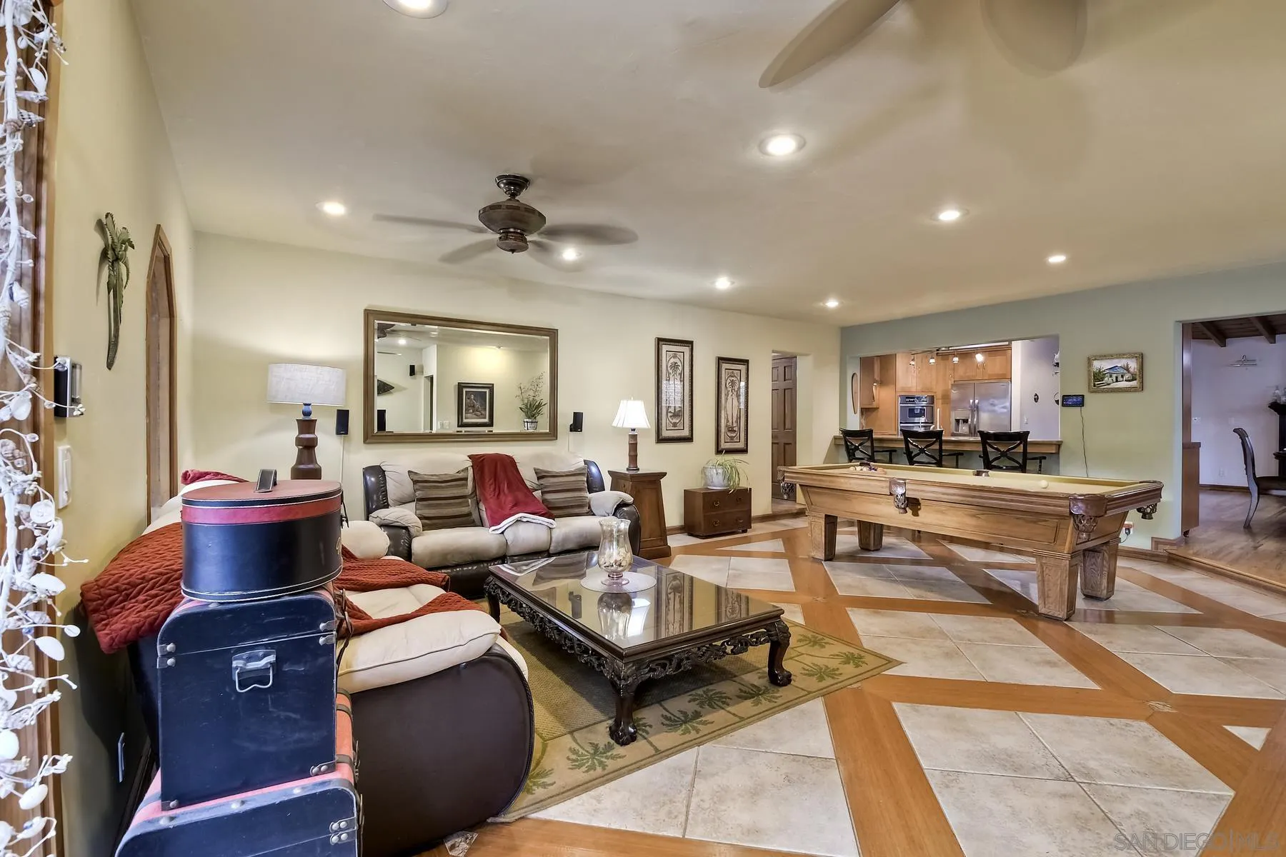 536 Saxony Road Encinitas, CA 92024 - Photo 25 of 57 a living room with lots of furniture and a view of kitchen