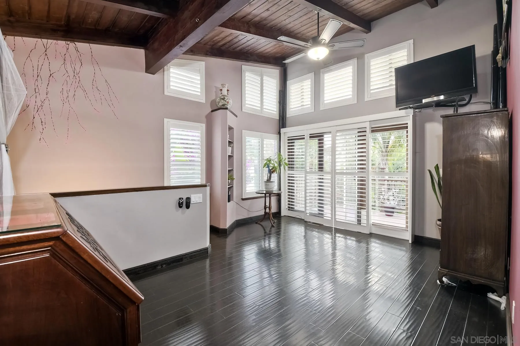 536 Saxony Road Encinitas, CA 92024 - Photo 28 of 57 a view of an empty room with wooden floor and a window
