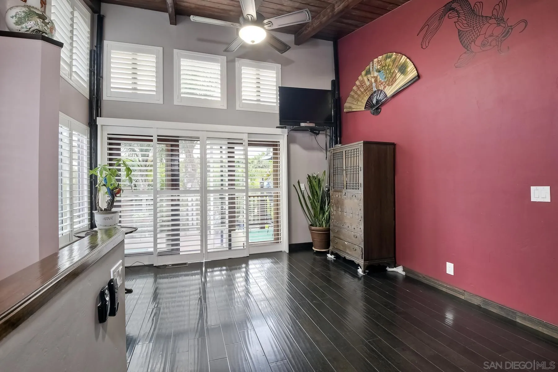 536 Saxony Road Encinitas, CA 92024 - Photo 29 of 57 a view of an empty room with a window and wooden floor