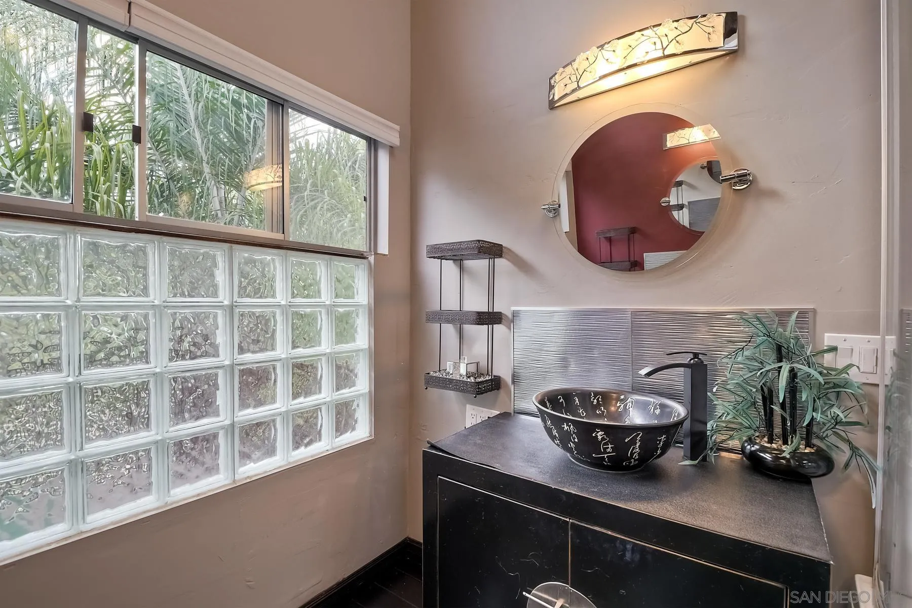 536 Saxony Road Encinitas, CA 92024 - Photo 31 of 57 a bathroom with a potted plant on the counter and a window