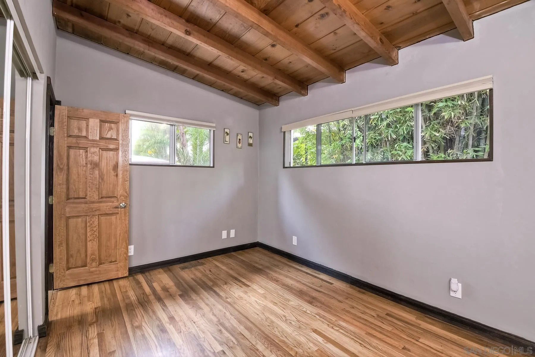 536 Saxony Road Encinitas, CA 92024 - Photo 32 of 57 a view of empty room with wooden floor and fan