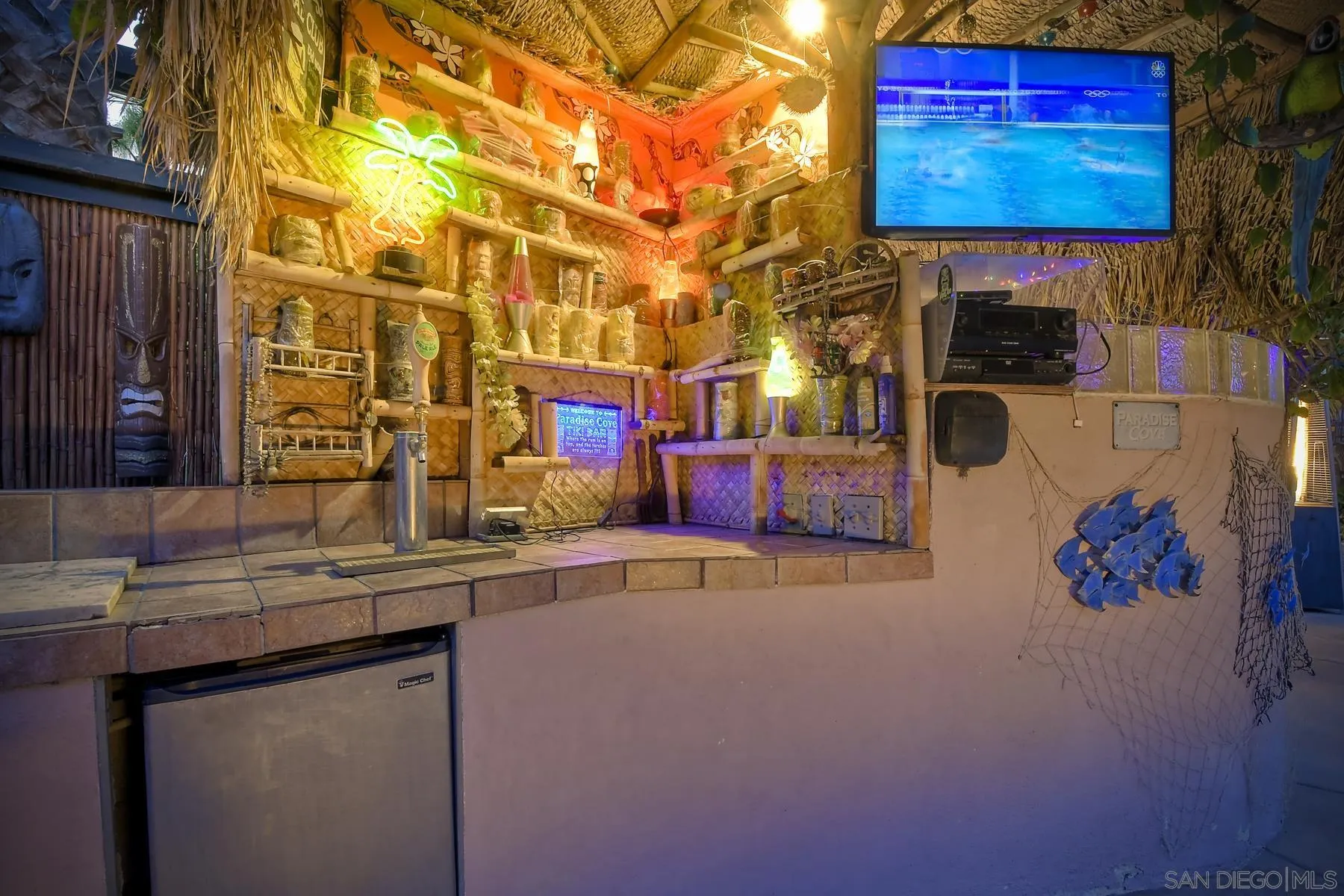 536 Saxony Road Encinitas, CA 92024 - Photo 38 of 57 a kitchen with stainless steel appliances a sink and a microwave