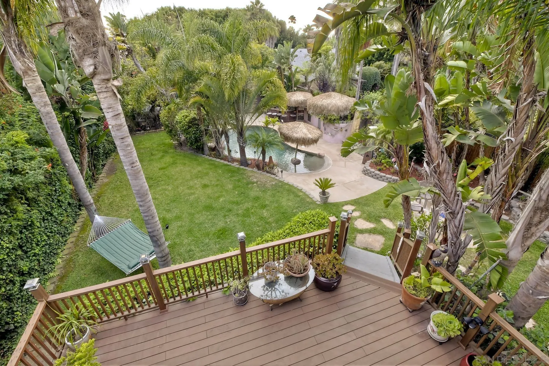 536 Saxony Road Encinitas, CA 92024 - Photo 4 of 57 a view of a deck with chairs and wooden floor