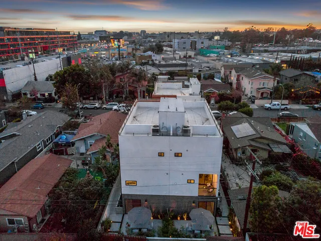 an aerial view of a house with outdoor space
