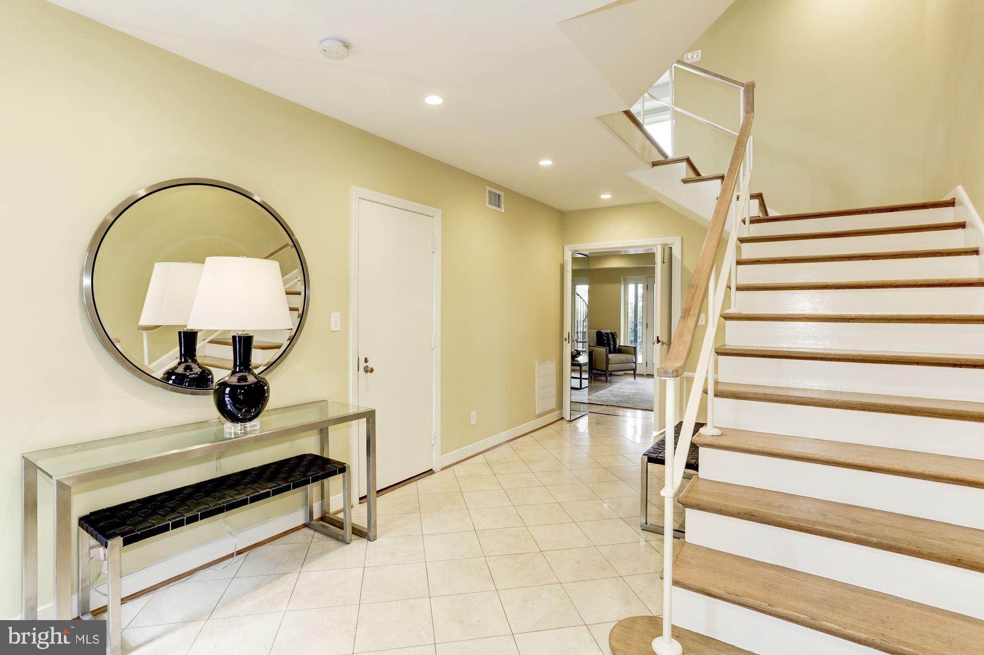 3604 Prospect Street Northwest Washington, DC 20007 - Photo 5 of 41 Foyer with Marble Tiles and Entrance to Garage