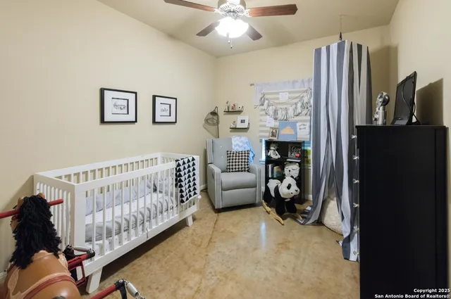 a bedroom with furniture and a window
