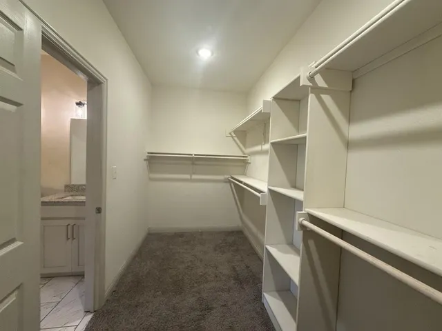 a view of an empty walk in closet