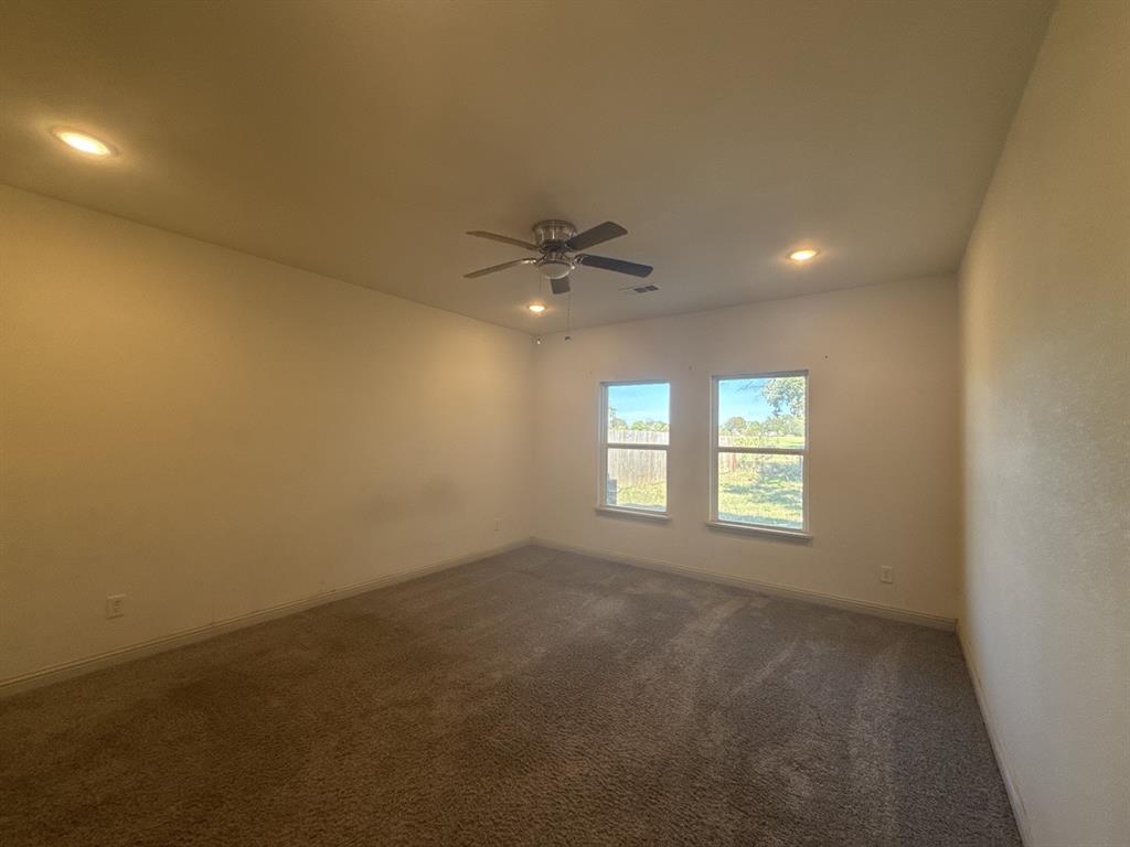 129 Towering Oaks Tool, TX 75143 - Photo 8 of 20 an empty room with a window