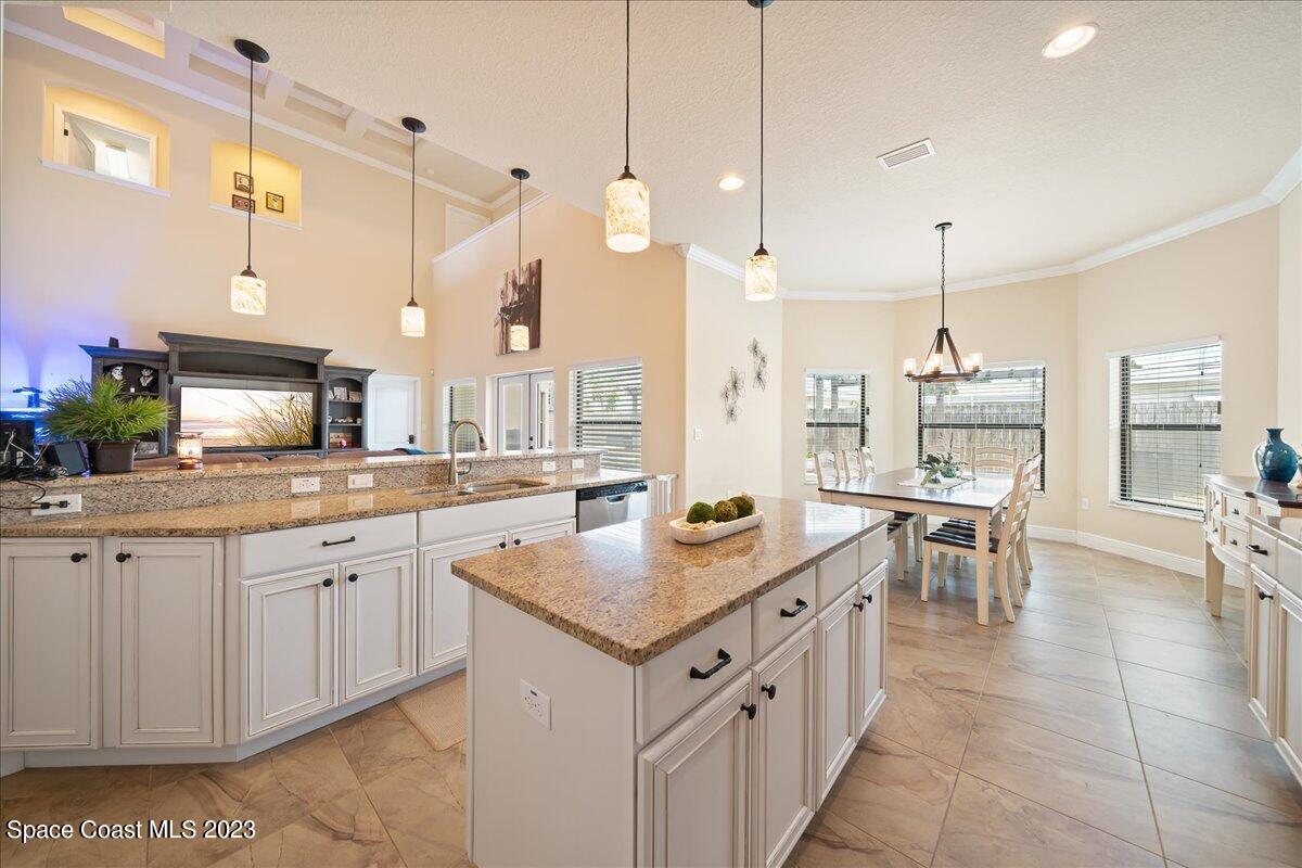 671 Palm Drive Satellite Beach, FL 32937 - Photo 11 of 69 a open kitchen with sink cabinets and stove