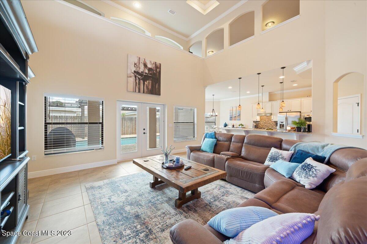 671 Palm Drive Satellite Beach, FL 32937 - Photo 18 of 69 a living room with furniture ceiling fan and a flat screen tv