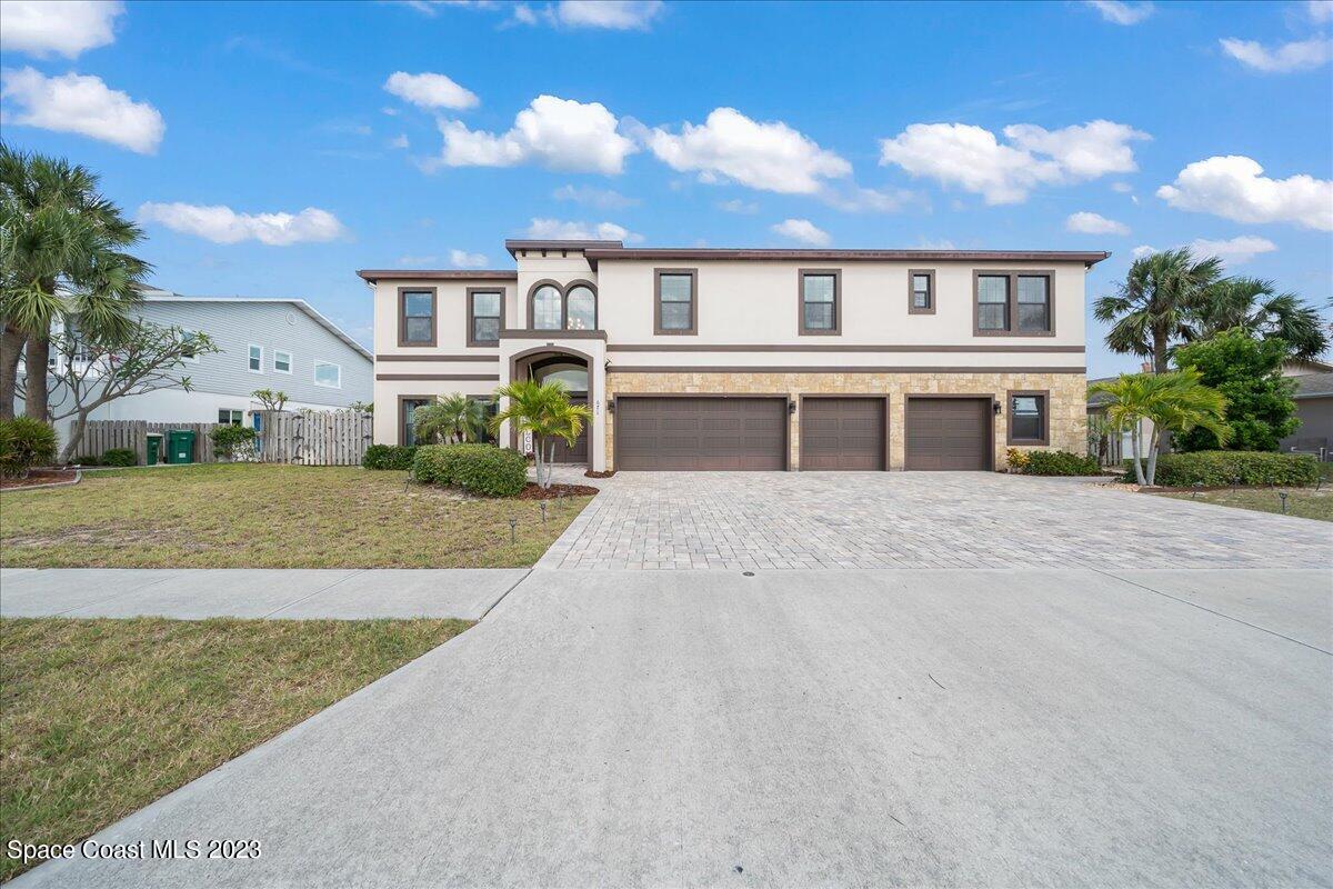 671 Palm Drive Satellite Beach, FL 32937 - Photo 2 of 69 a front view of residential houses with yard