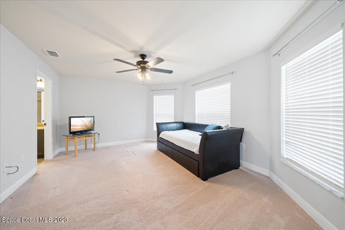 671 Palm Drive Satellite Beach, FL 32937 - Photo 26 of 69 a living room with furniture and a ceiling fan