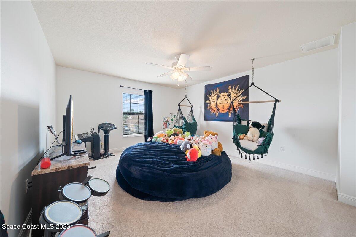 671 Palm Drive Satellite Beach, FL 32937 - Photo 31 of 69 a room with furniture and a mirror