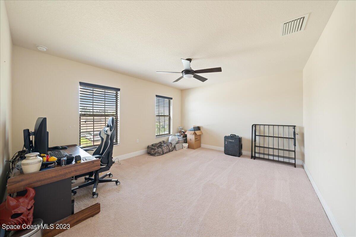 671 Palm Drive Satellite Beach, FL 32937 - Photo 34 of 69 a view of a livingroom with workspace and a window