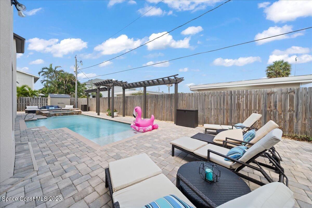 671 Palm Drive Satellite Beach, FL 32937 - Photo 38 of 69 a view of a patio with a table and chairs