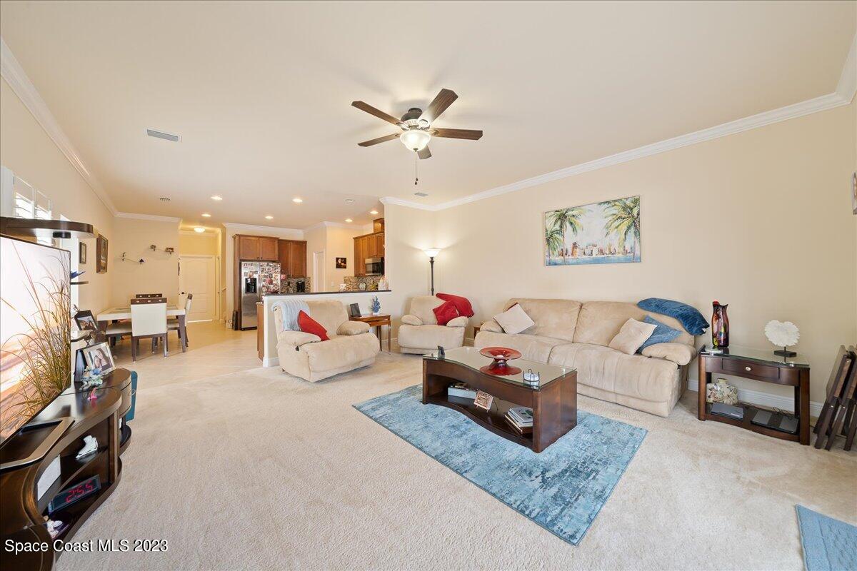671 Palm Drive Satellite Beach, FL 32937 - Photo 44 of 69 a living room with furniture and a flat screen tv