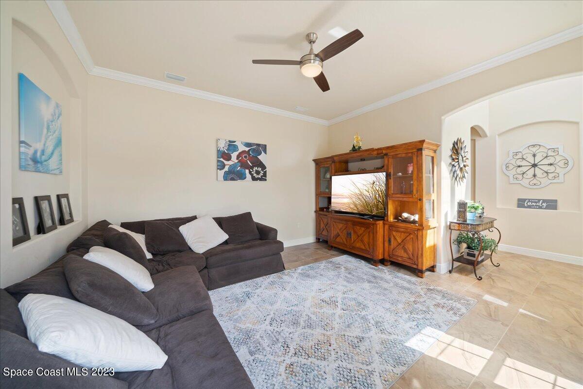 671 Palm Drive Satellite Beach, FL 32937 - Photo 8 of 69 a living room with furniture and a flat screen tv