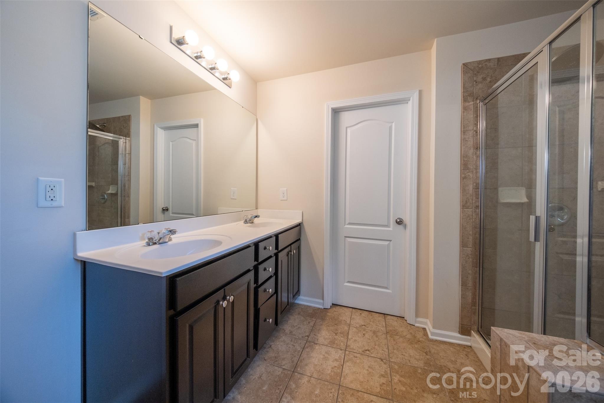 3006 Houndscroft Road Indian Trail, NC 28079 - Photo 36 of 39 a kitchen with a sink and a mirror