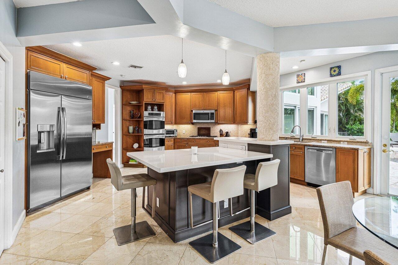 2450 Northwest 41st Street Boca Raton, FL 33431 - Photo 14 of 62 a view of a dining room with furniture window and outside view