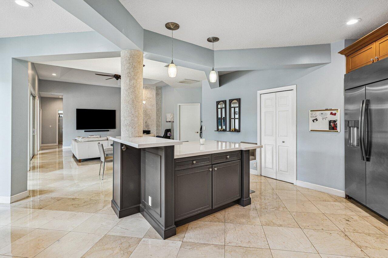 2450 Northwest 41st Street Boca Raton, FL 33431 - Photo 15 of 62 a bathroom with a sink and a mirror