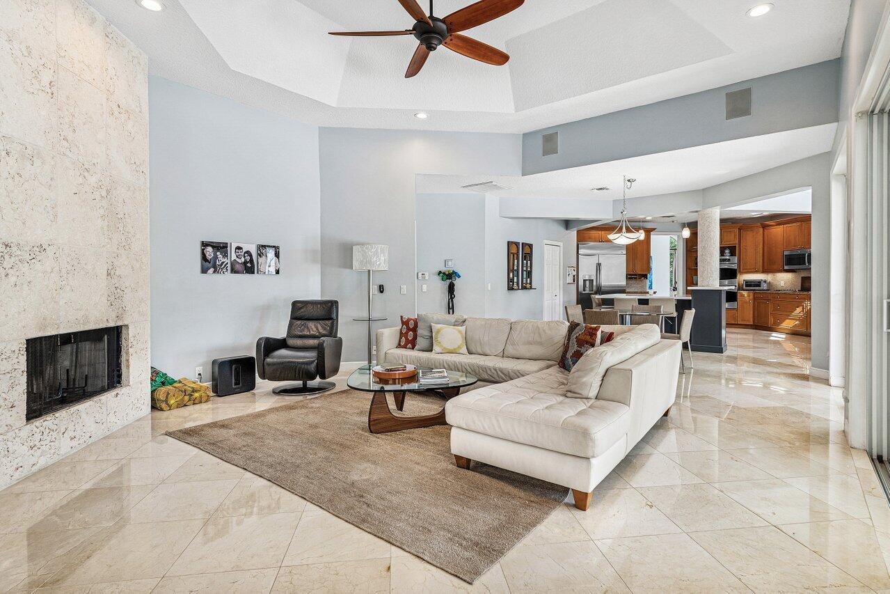 2450 Northwest 41st Street Boca Raton, FL 33431 - Photo 17 of 62 a living room with furniture and a flat screen tv