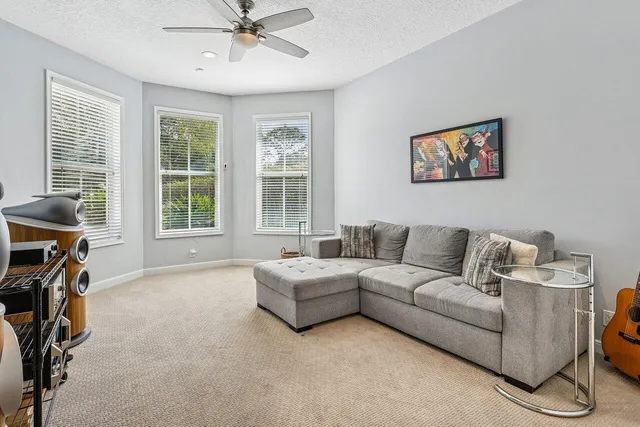an aerial view of a house with outdoor space and swimming pool