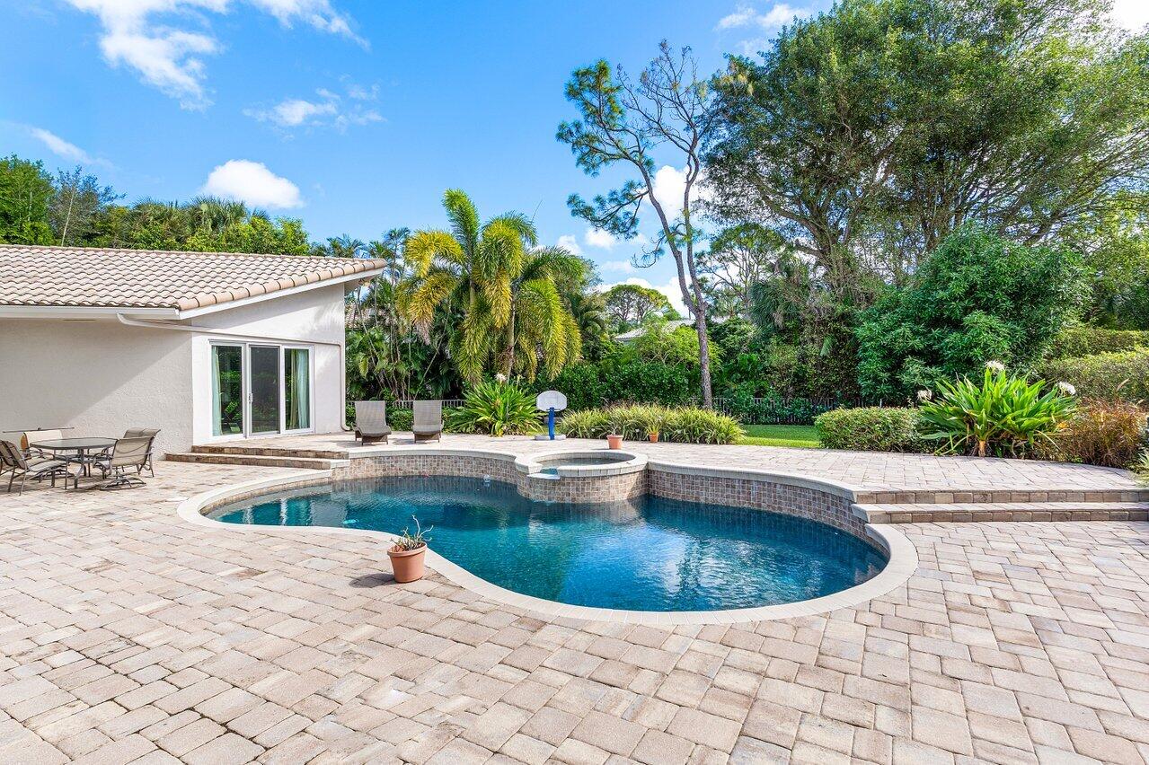 2450 Northwest 41st Street Boca Raton, FL 33431 - Photo 33 of 62 a view of a swimming pool with lounge chair