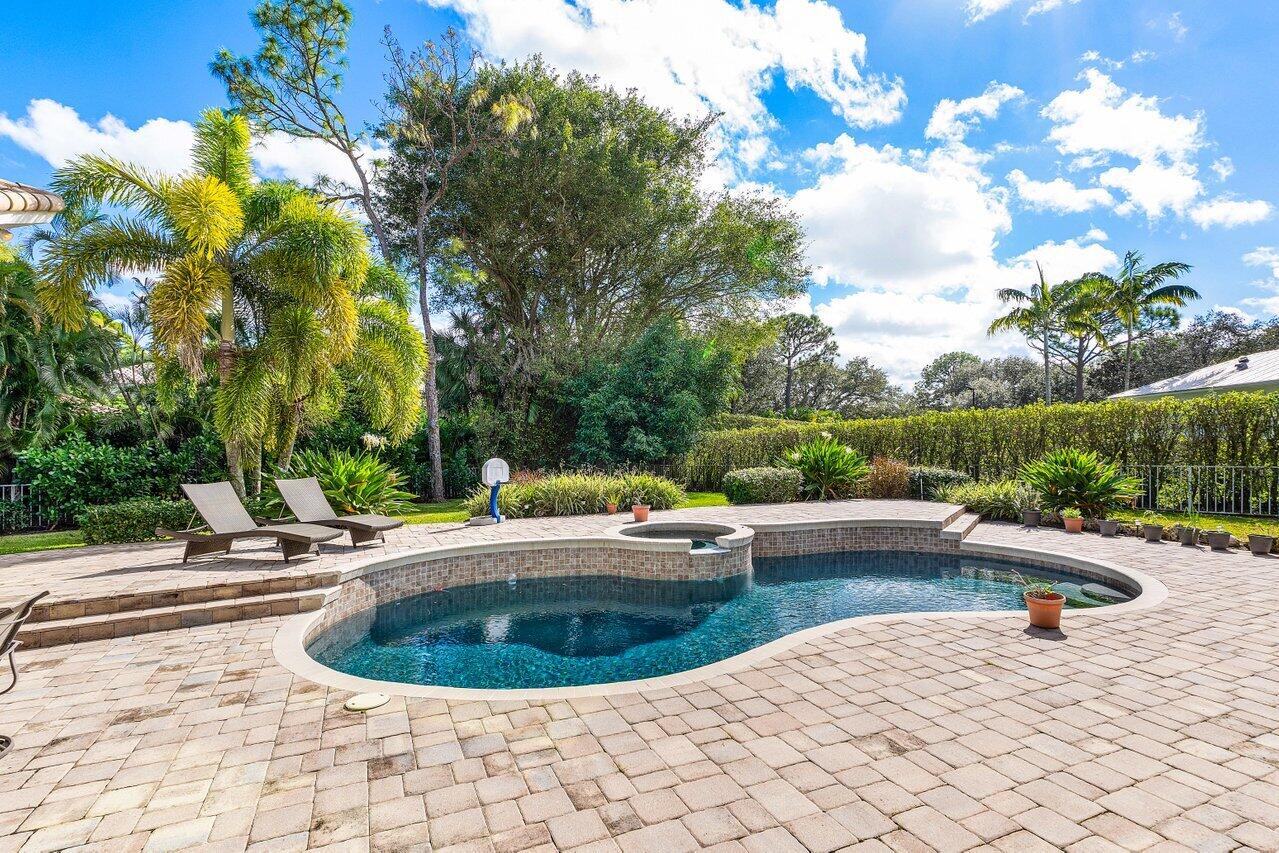 2450 Northwest 41st Street Boca Raton, FL 33431 - Photo 35 of 62 a view of a swimming pool and lounge chair
