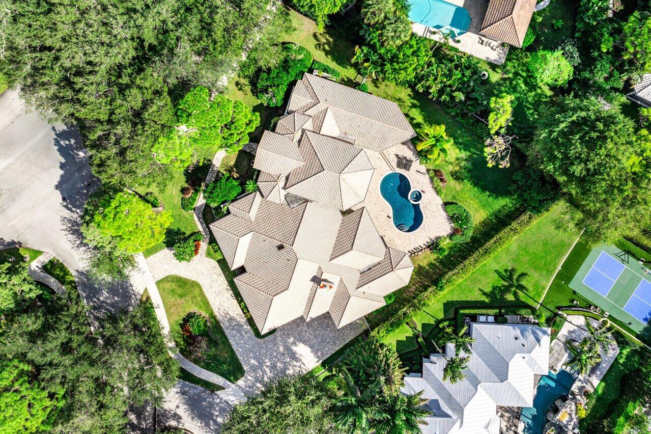 2450 Northwest 41st Street Boca Raton, FL 33431 - Photo 42 of 62 an aerial view of a house with a yard and garden
