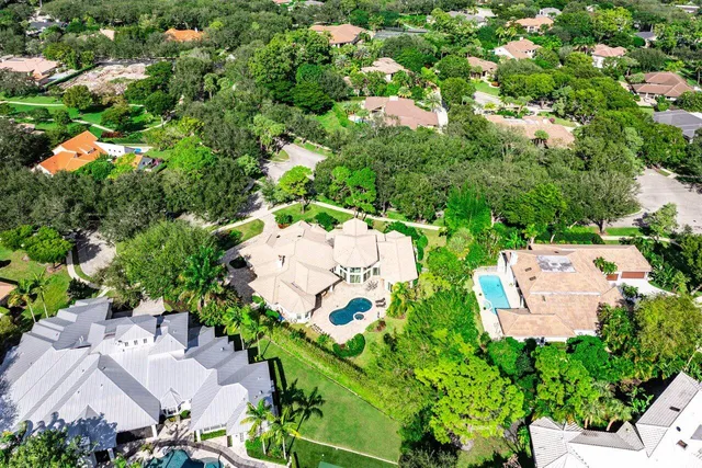a view of the house with swimming pool and furniture