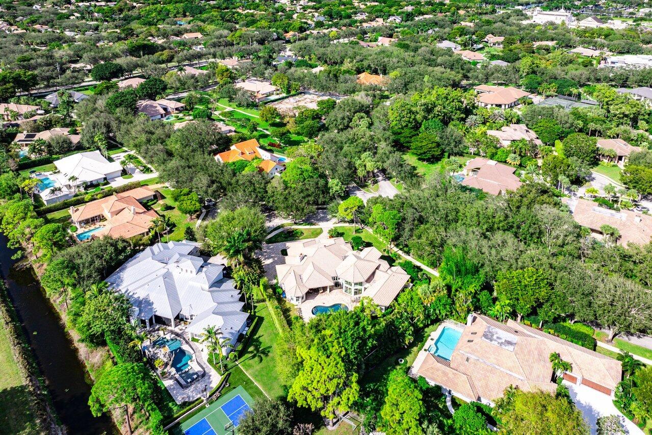 2450 Northwest 41st Street Boca Raton, FL 33431 - Photo 48 of 62 an aerial view of residential house with outdoor space and trees all around