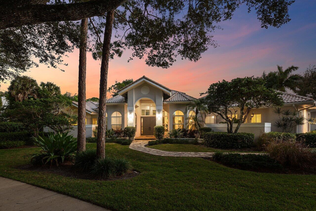 2450 Northwest 41st Street Boca Raton, FL 33431 - Photo 53 of 62 a front view of a house with garden