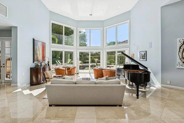a view of a dining room with furniture window and outside view