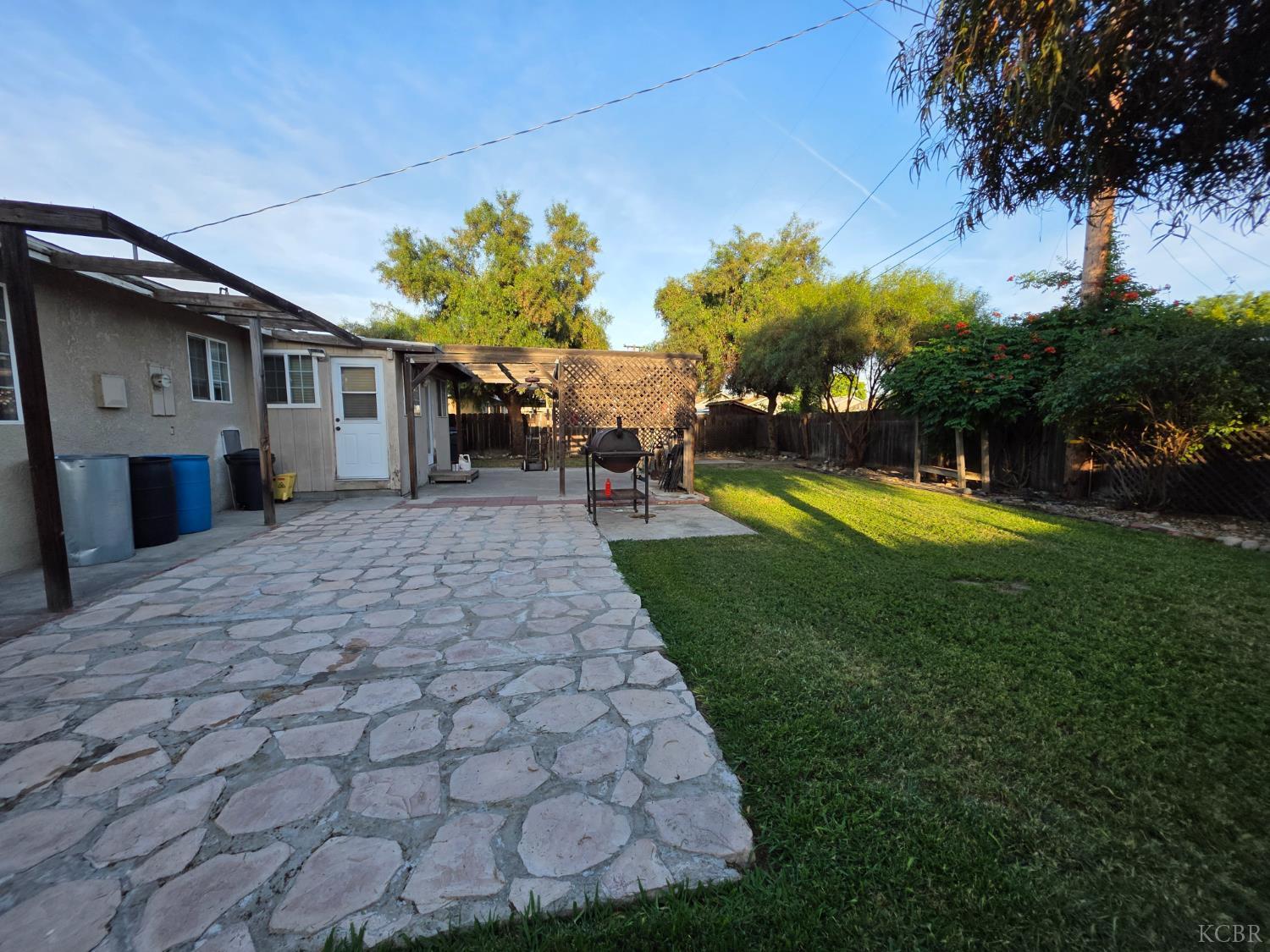 275 Ida Way Hanford, CA 93230 - Photo 20 of 21 a view of a house with a yard porch and sitting area