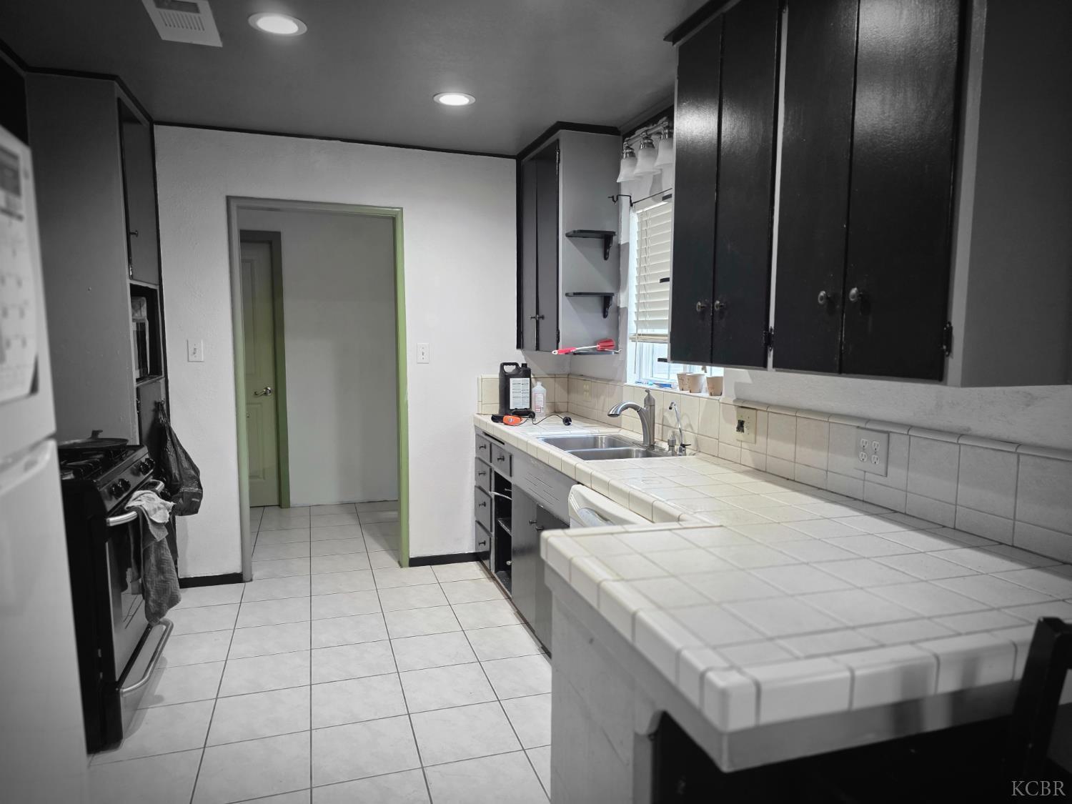 275 Ida Way Hanford, CA 93230 - Photo 7 of 21 a kitchen with a sink appliances and cabinets