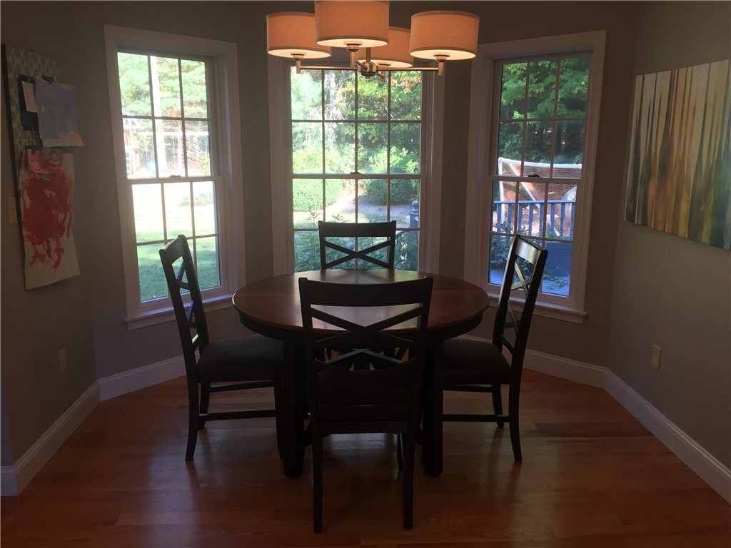 6 Princess Pine Road Lincoln, RI 02865 - Photo 11 of 40 The eat in kitchen has a great breakfast area. Three, large windows bring the outside in and also overlook the rear deck/backyard.