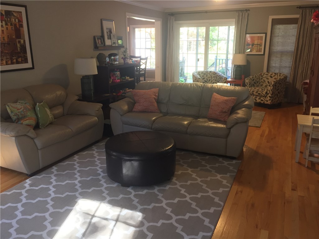 6 Princess Pine Road Lincoln, RI 02865 - Photo 12 of 40 The large living room can be entered by the front hall or the kitchen and also leads to a walk out deck through a walk out deck through sliders.