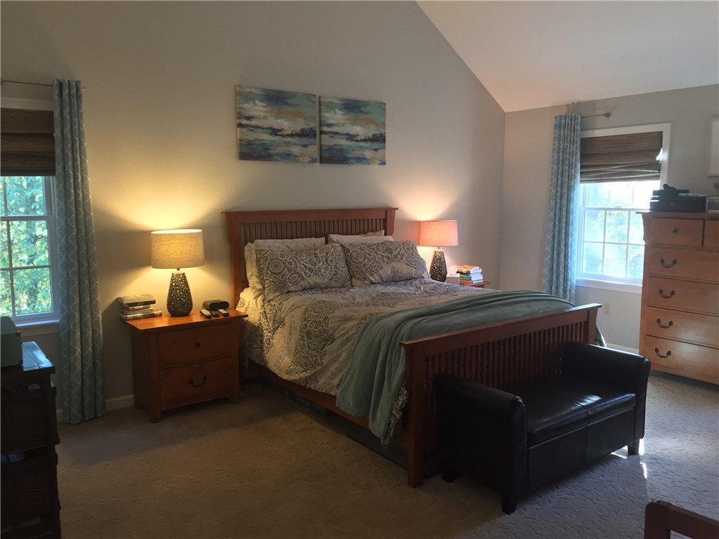 6 Princess Pine Road Lincoln, RI 02865 - Photo 20 of 40 Oversized master bedroom with a walk in closet and vaulted ceilings.