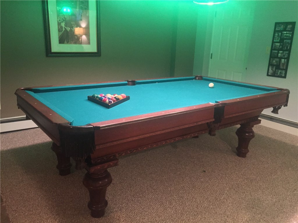 6 Princess Pine Road Lincoln, RI 02865 - Photo 29 of 40 Bulkhead access as well as interior access and baseboard heating. The size of this pool table showcases the spaciousness of the areas in the lower level.