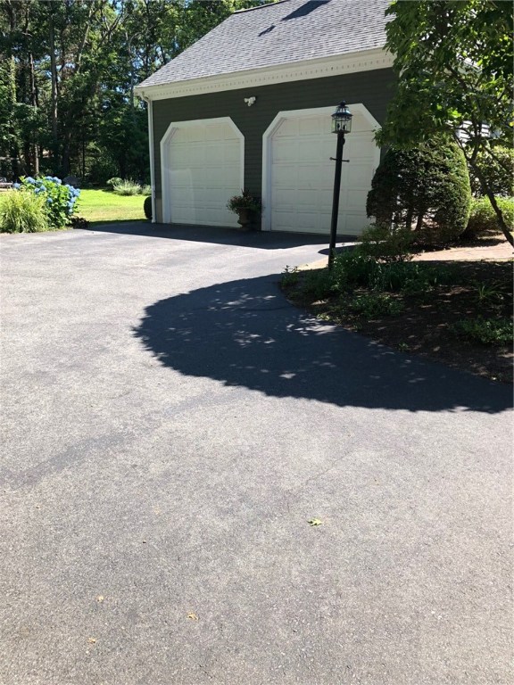 6 Princess Pine Road Lincoln, RI 02865 - Photo 38 of 40 Two car garage with onsite parking for 6 cars. Paved driveway for easy cleanup.