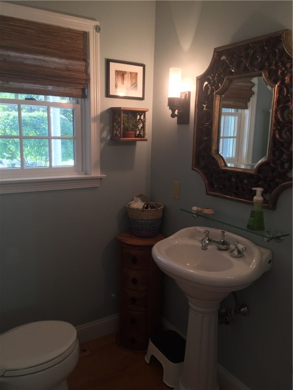 6 Princess Pine Road Lincoln, RI 02865 - Photo 7 of 40 The first floor, half bath is located across from the first floor bedroom/office.