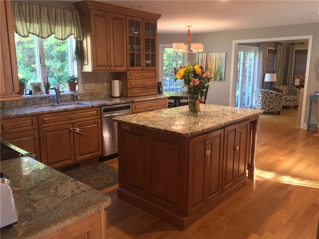 6 Princess Pine Road Lincoln, RI 02865 - Photo 8 of 40 This custom, granite kitchen has all sorts of upgrades. Gleaming hardwood floors throughout the first level and tons windows for natural light with views of the backyard.