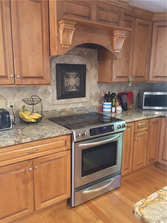 6 Princess Pine Road Lincoln, RI 02865 - Photo 9 of 40 Custom cabinetry and stainless appliances. Neutral colors will fit anyone's pallet.