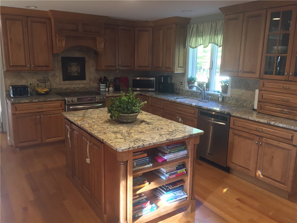 6 Princess Pine Road Lincoln, RI 02865 - Photo 10 of 40 The center island is not only functional but features additional storage.