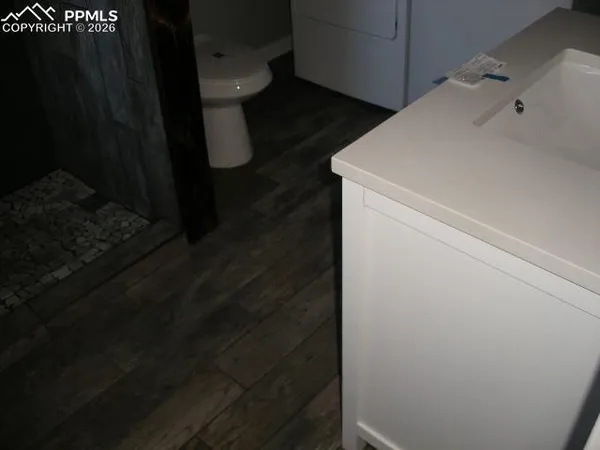 a bathroom with a sink and mirror