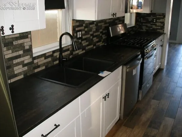 a bathroom with a sink a toilet and a tub