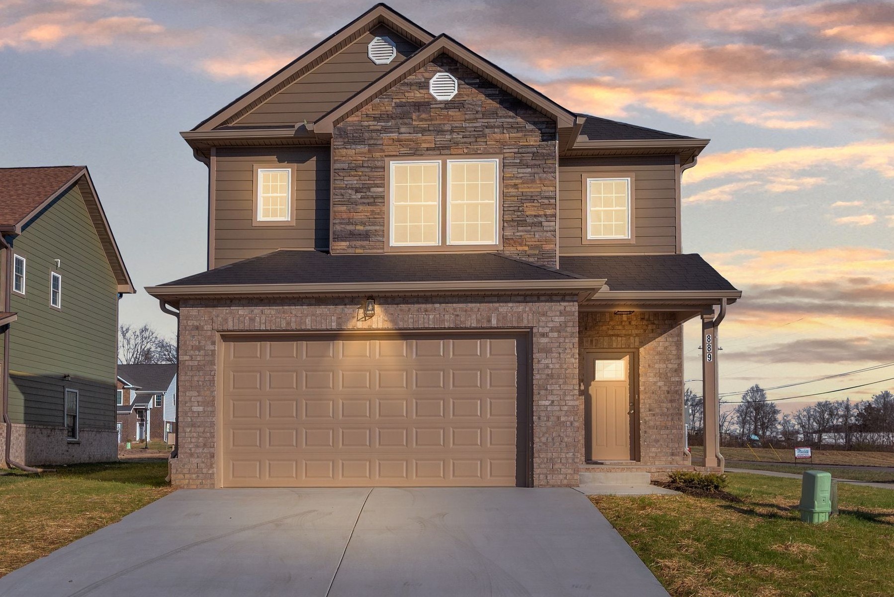a front view of a house with a yard